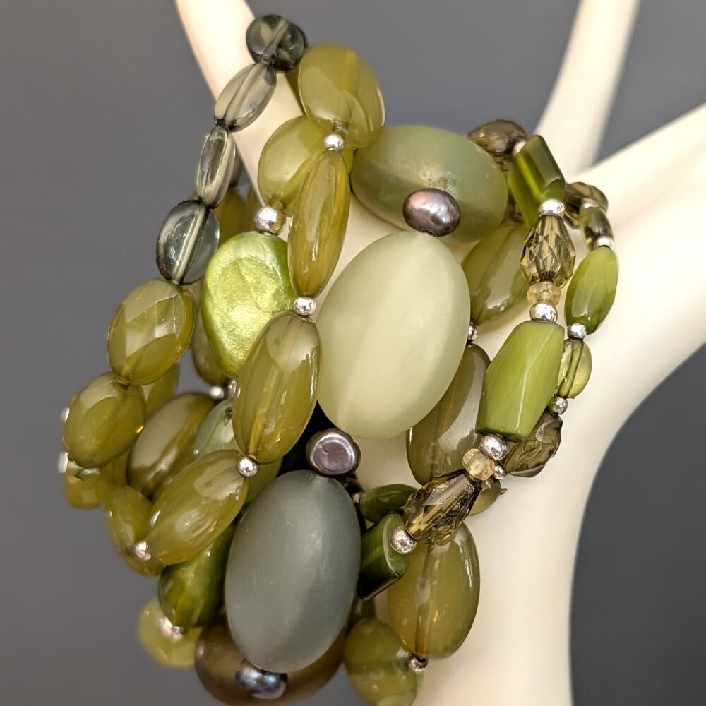 Bundle of shades of green with gray and yellow accents stretch bracelets